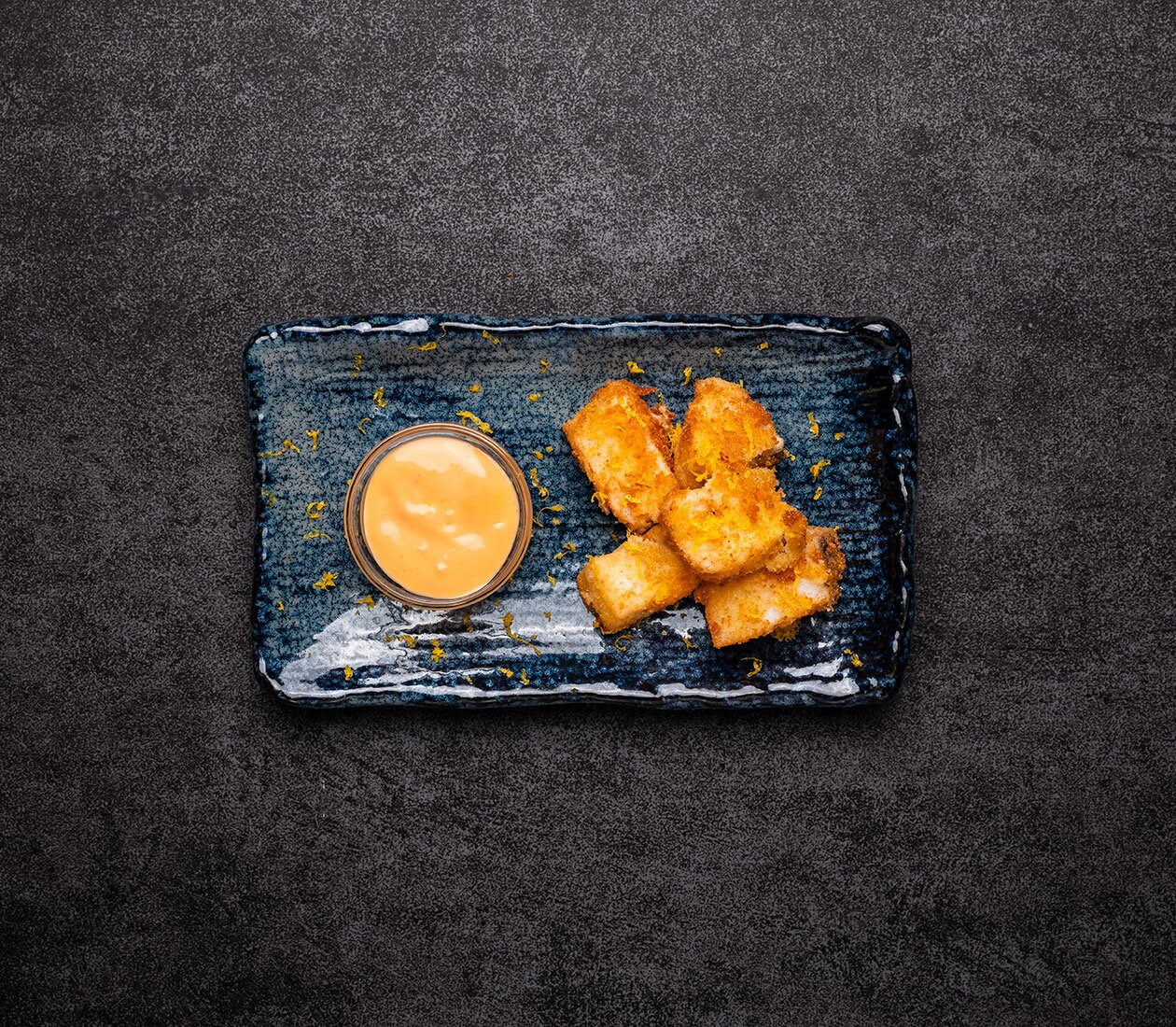 Fried Norwegian clipfish with orange flavoured breading