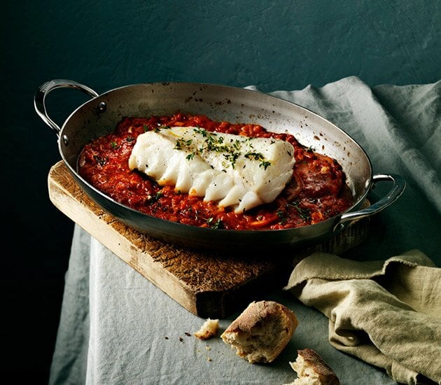 Baked skrei with tomato and garlic